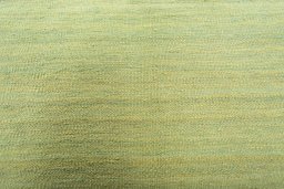 Backside of handmade New Modern Design rug showing knot structure and weave density