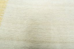 Backside of handmade New Modern Design rug showing knot structure and weave density