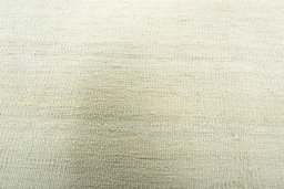 Backside of handmade New Modern Design rug showing knot structure and weave density