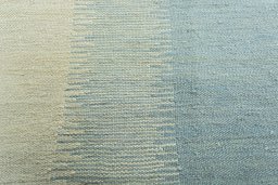 Backside of handmade New Modern Design rug showing knot structure and weave density