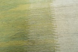 Backside of handmade New Modern Design rug showing knot structure and weave density