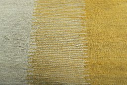 Backside of handmade New Modern Design rug showing knot structure and weave density