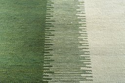 Backside of handmade New Modern Design rug showing knot structure and weave density
