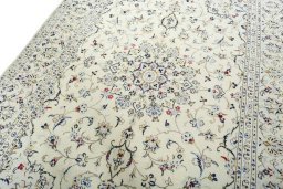 Backside of handmade 2000s Kashan rug showing knot structure and weave density