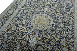 Backside of handmade New Kashan rug showing knot structure and weave density