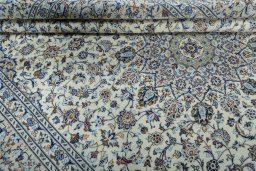 Close-up detail of 2000s Kashan rug from Iran / Persia showing Wool weave