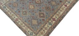 Backside of handmade New Kazak rug showing knot structure and weave density