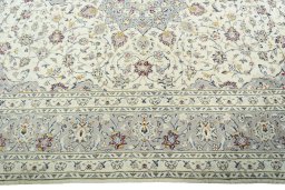 Corner detail of New Kashan rug showing border pattern and Cork pile