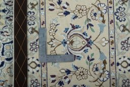 Backside of handmade 2000s Nain rug showing knot structure and weave density