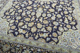 Close-up detail of 2000s Kashan rug from Iran / Persia showing Wool weave
