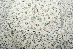 Close-up detail of 2000s Kashan rug from Iran / Persia showing Wool weave
