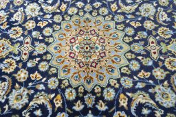 Central medallion detail of 2000s Kashan rug from Iran / Persia