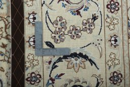 Backside of handmade 2000s Nain rug showing knot structure and weave density