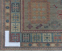 Corner detail of New Kazak rug showing border pattern and Wool pile