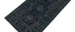 Backside of handmade New Farahan rug showing knot structure and weave density