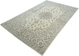 Corner detail of 2000s Kashan rug showing border pattern and Wool pile