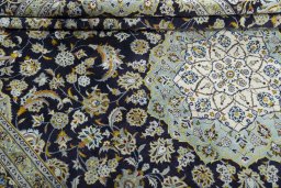 Close-up detail of 2000s Kashan rug from Iran / Persia showing Wool weave