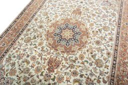 Backside of handmade 2000s Tabriz 50/60/70 Raj rug showing knot structure and weave density