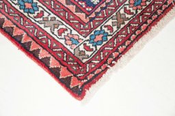 Backside of handmade New Abadeh rug showing knot structure and weave density