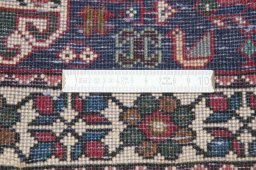 Backside of handmade New Abadeh rug showing knot structure and weave density