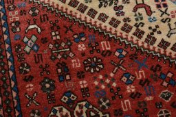 Backside of handmade 2000s Abadeh rug showing knot structure and weave density