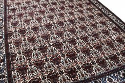 Surface texture of 1950s Abadeh rug with natural Wool and intricate pattern