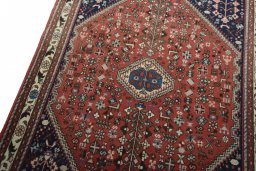 Backside of handmade New Abadeh rug showing knot structure and weave density