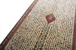 Backside of handmade New Abadeh rug showing knot structure and weave density