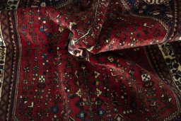 Corner detail of 2000s Abadeh rug showing border pattern and Wool pile