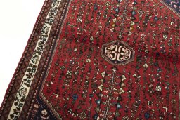 Backside of handmade 2000s Abadeh rug showing knot structure and weave density