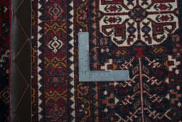Surface texture of 1950s Abadeh rug with natural Wool and intricate pattern