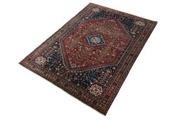 Corner detail of 1950s Abadeh rug showing border pattern and Wool pile
