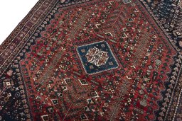 Backside of handmade 1950s Abadeh rug showing knot structure and weave density