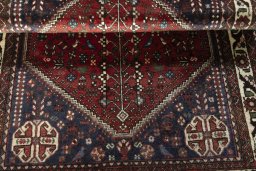 Corner detail of 2000s Abadeh rug showing border pattern and Wool pile