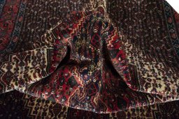 Corner detail of 1970s Afshar rug showing border pattern and Wool pile