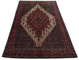 Surface texture of 1970s Afshar rug with natural Wool and intricate pattern