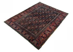 Corner detail of 1930s Afshar rug showing border pattern and Wool pile
