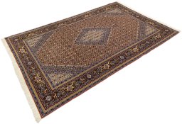 Corner detail of 1990s Ardebil rug showing border pattern and Wool pile