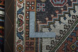 Close-up detail of 2000s Ardebil rug from Iran / Persia showing Wool weave