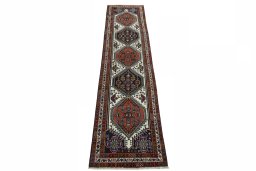 Surface texture of 2000s Ardebil rug with natural Wool and intricate pattern