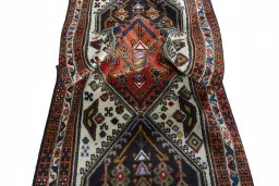 Corner detail of 2000s Ardebil rug showing border pattern and Wool pile