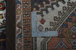 Close-up detail of 2000s Ardebil rug from Iran / Persia showing Wool weave