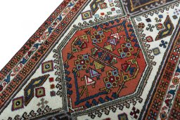 Backside of handmade 2000s Ardebil rug showing knot structure and weave density