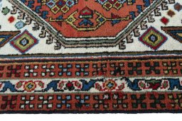 Close-up detail of 2000s Ardebil rug from Iran / Persia showing Wool weave