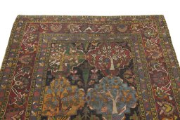 Surface texture of 1900s Bakhtiar rug with natural Wool and intricate pattern