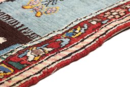 Backside of handmade 1920s Bakhtiar rug showing knot structure and weave density