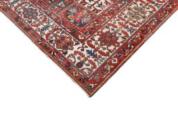 Surface texture of 1920s Bakhtiar rug with natural Wool and intricate pattern