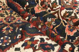 Corner detail of 1940s Bakhtiar rug showing border pattern and Wool pile