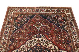 Surface texture of 1940s Bakhtiar rug with natural Wool and intricate pattern