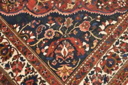 Full view of 1940s Bakhtiar rug from Iran / Persia, 360 × 250 cm in Red tones